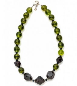 Deep red faceted Garnet, round marble Peridot and Sterling silver spacer.